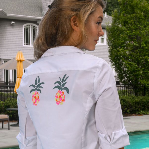 back of woman wearing white collared shirt with pineapple design glam photo